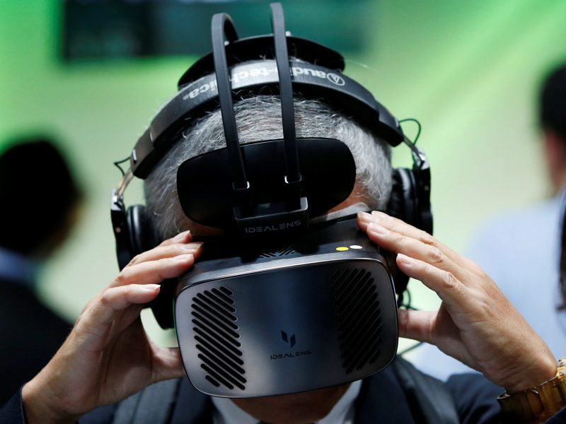 A man wears Virtual Reality Head Mount at VR/AR World during Content Tokyo expo in Tokyo, Japan June 28, 2017. REUTERS/Kim Kyung-Hoon