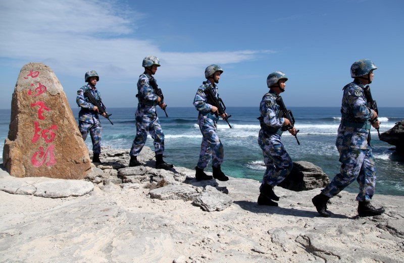 China's People's Liberation Army (PLA) Navy soldiers patrol at Woody Island, in the Paracel Archipelago in the South China Sea. Photo: Reuters