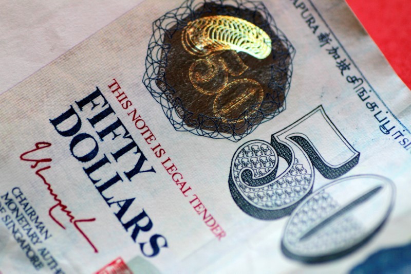 A Singapore dollar note in a May 31, 2017 photo.     Photo: Reuters/Thomas White/Illustration/File Photo